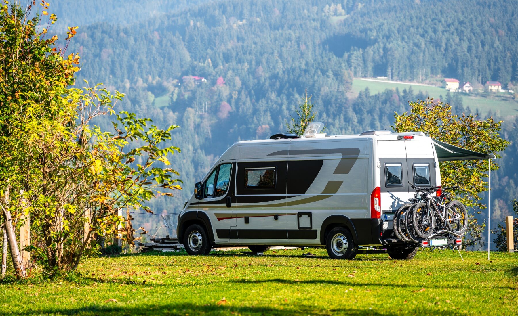 Campervan,Or,Motorhome,With,Bicycle,Rack,Parked,In,The,Nature